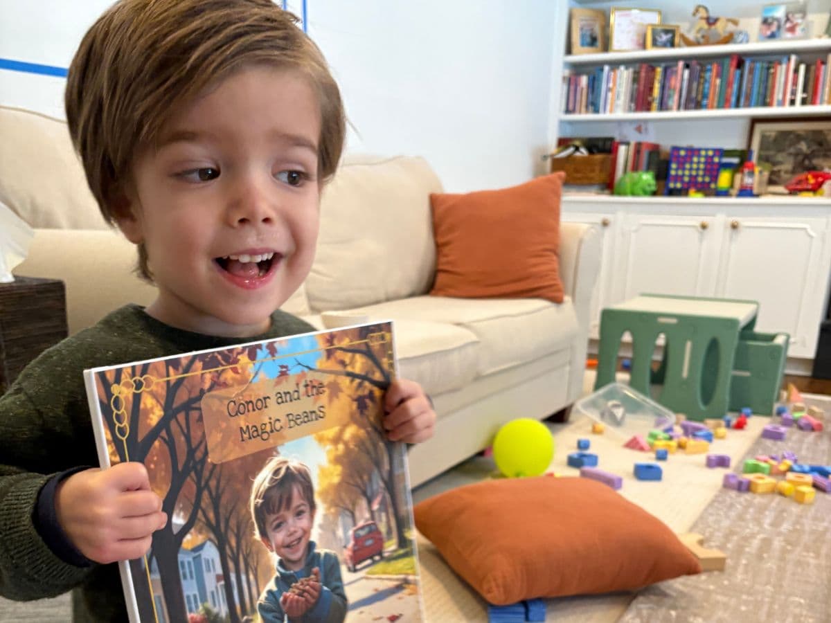 Child reading a personalized storybook with joy